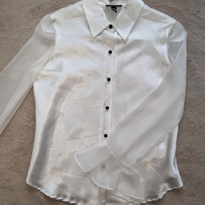 A satin button-up blouse.